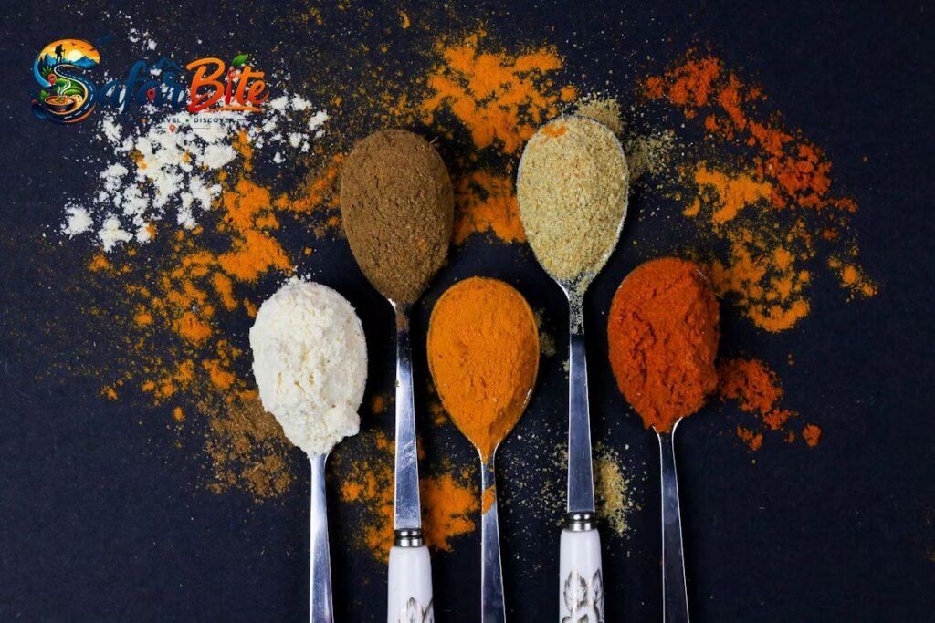 The Local Pantry: 4 Authentic Food Souvenirs Jaipur Locals Actually Buy Assorted authentic Rajasthani food souvenirs including dried red chillies, whole spices, and savory snacks on a rustic table