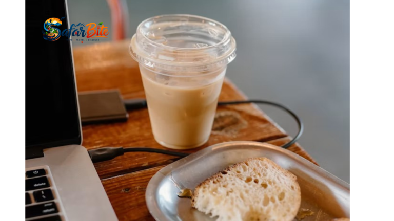 Remote worker working on laptop with specialty coffee at a cafe in C-Scheme Jaipur